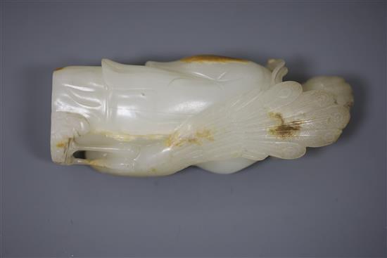 A fine Chinese white and russet jade group of Xi Wangmu and a phoenix, 19th/20th century, 9.5cm high, wood stand